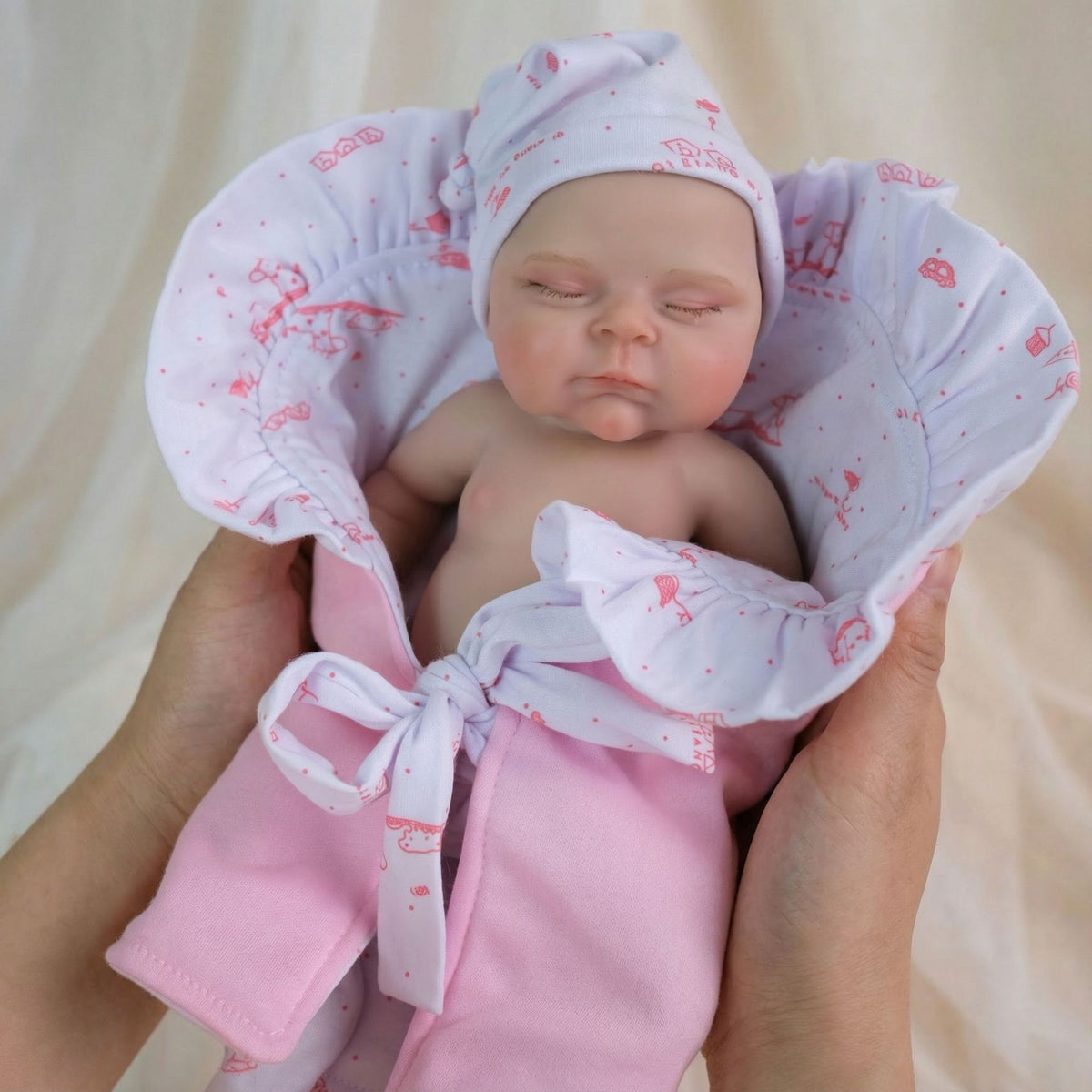 12 inch pink bag with pascale solid silicone reborn doll as a Christmas gift for children