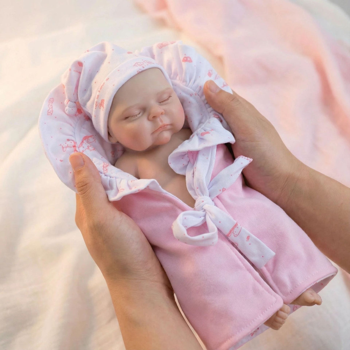 12 inch pink bag with pascale solid silicone reborn doll as a Christmas gift for children
